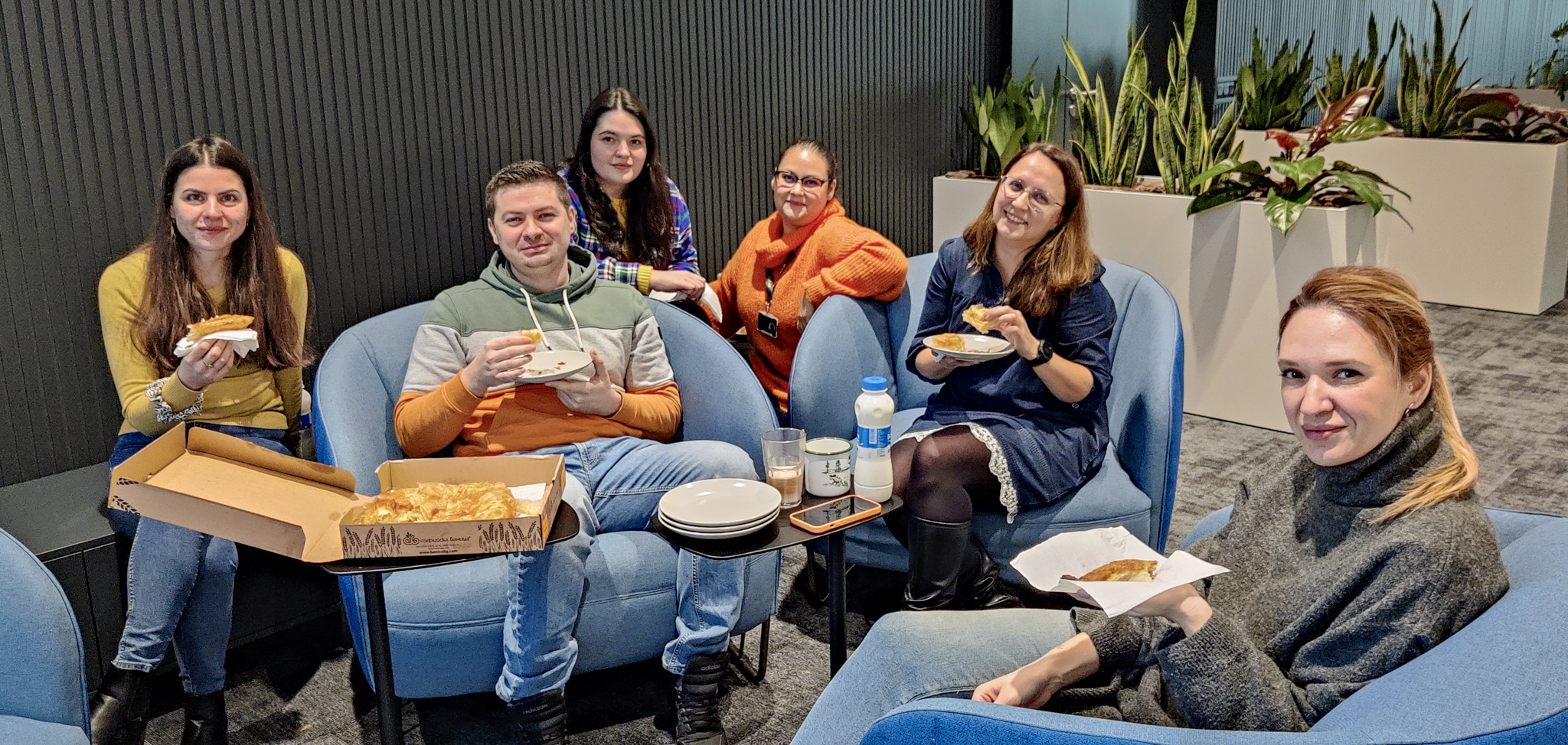 Amusnet employees having some traditional banitsa